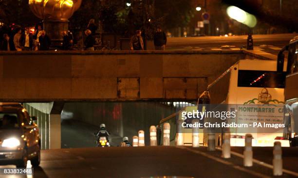 Coaches carrying the jury from inquest into the deaths of Diana, Princess of Wales and Dodi Fayed arrive at the Pont de l'Alma tunnel in Paris where...