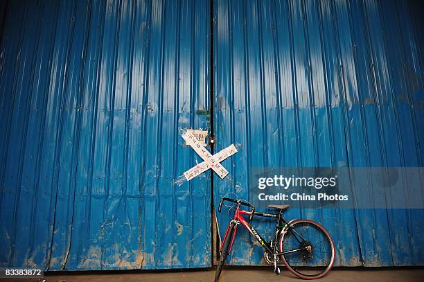 Seal attached by a local court is seen on the gate of the Junling Branch Factory of Smart Union Group Limited., a Hong Kong listed company and...