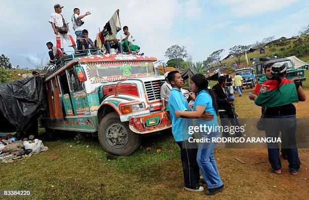 Colombian indigenous marching to Cali as a protest to demand the restitution of lands and the respect of their autonomy, dance on October 22, 2008 in...