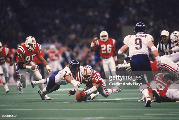 Super Bowl XX: New England Patriots Larry McGrew in action, diving for loose ball vs Chicago Bears Jim Covert . New Orleans, LA 1/26/1986 CREDIT:...
