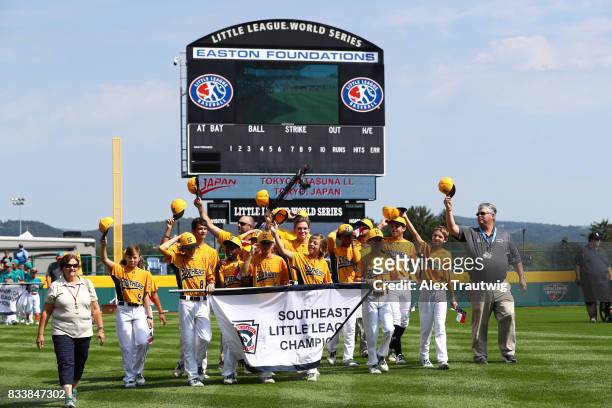 The Southeast team from North State Little League in Greenville, North Carolina take the field during the Opening Ceremonies of the 2017 Little...