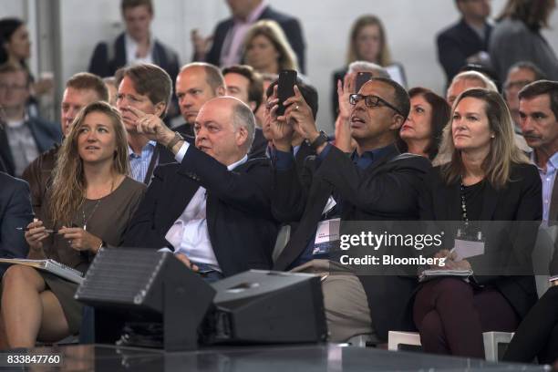Jim Hackett, president and chief executive officer of Ford Motor Co., second left, gestures as Ken Washington, chief technology officer and vice...