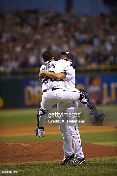 Playoffs: Tampa Bay Rays David Price victorious, hugging Dioner Navarro after winning Game 7 and series vs Boston Red Sox. St. Petersburg, FL CREDIT:...
