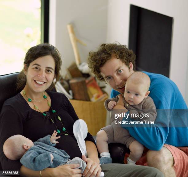 young couple with babies - famiglia con due figli foto e immagini stock