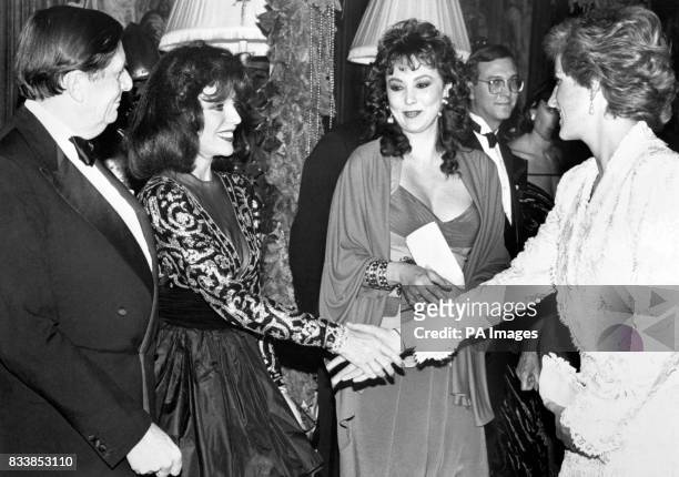 The Princess of Wales meets Joan Collins at a Gala Dinner in aid of the AIDS Crisis Trust, held at Cliveden House, Berkshire. The guests included...