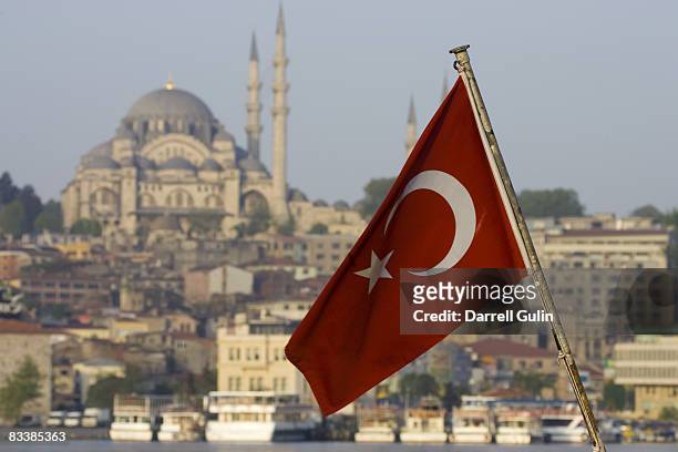 turkish flag and mosque just above the bosphorus  - istanbul stock pictures, royalty-free photos & images