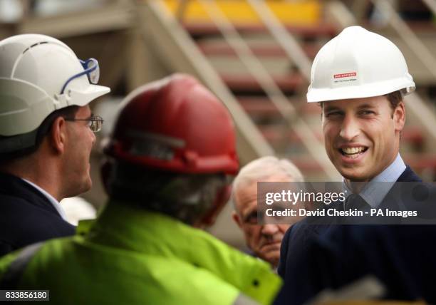 Prince William talks to workers during a visit to BAE Systems Surface Fleet Solutions in Scotstoun, before he boarded HMS Daring at the Scotstoun...