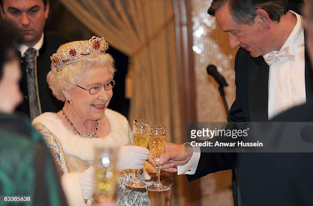 Queen Elizabeth ll shares a toast with President Danilo Turk during a State Banquet at Brdo Castle on the first day of a State Visit to Slovenia on...