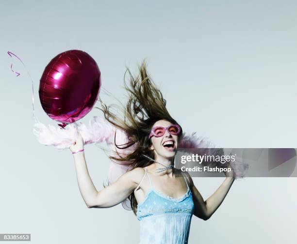 portrait of woman celebrating - boa stock pictures, royalty-free photos & images