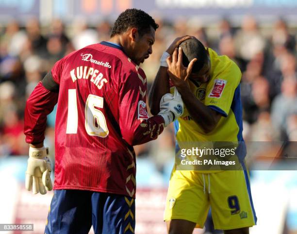 Brighton and Hove Albion's Michael Kuipers and Leeds United's Jermaine Beckford come to blows during the Coca-Cola Football League One match at the...