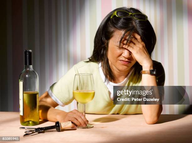 alcoholic woman with wine - kater alkohol stock-fotos und bilder