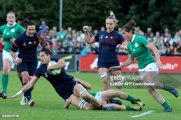 France's lock Lenaig Corson is tackled during the Women's Rugby World Cup 2017 pool C rugby match between France and Ireland at The UCD Bowl in...
