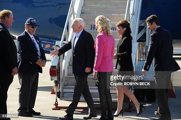 Republican presidential candidate John McCain is followed by his wife Cindy his running mate Sarah Palin and Palin's husband Todd as they greet local...