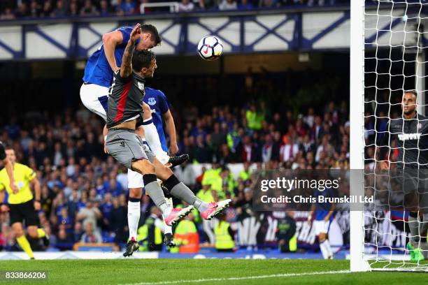 Michael Keane of Everton heads the opening goal during the UEFA Europa League Qualifying Play-Offs round first leg match between Everton FC and...