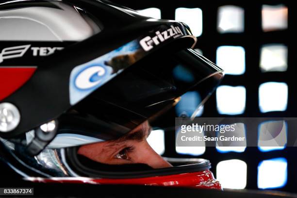 Austin Dillon, driver of the Rheem Chevrolet, sits in his car during practice for the NASCAR Xfinity Series Food City 300 at Bristol Motor Speedway...