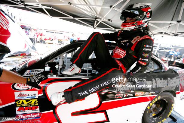 Austin Dillon, driver of the Rheem Chevrolet, gets into his car during practice for the NASCAR Xfinity Series Food City 300 at Bristol Motor Speedway...
