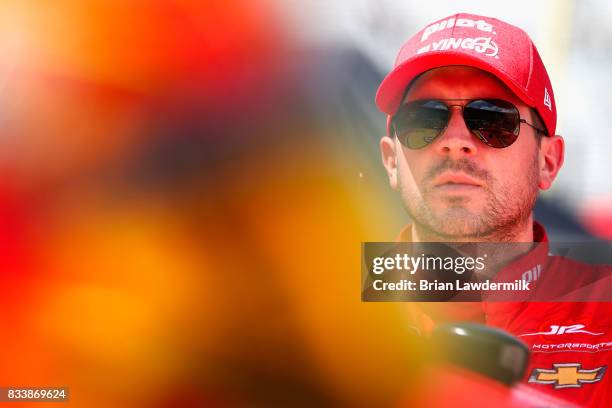 Michael Annett, driver of the Pilot Flying J Chevrolet, stands by his car during practice for the NASCAR Xfinity Series Food City 300 at Bristol...