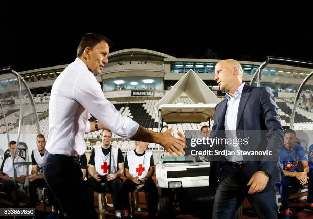 Head coach Miroslav Djukic of Partizan shake hands with the head coach Marko Nikolic of Videoton prior the UEFA Europa League Qualifying Play-Offs...