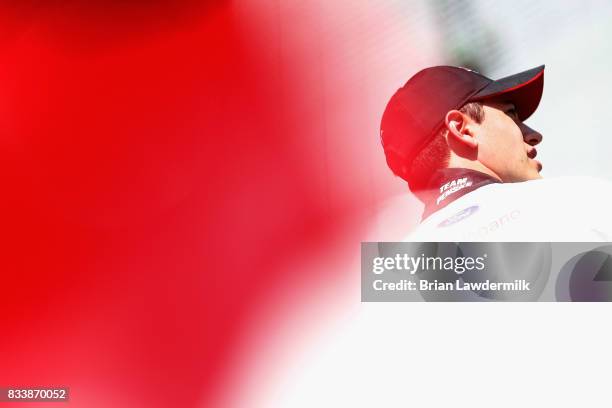 Joey Logano, driver of the Discount Tire Ford, stands by his car during practice for the NASCAR Xfinity Series Food City 300 at Bristol Motor...