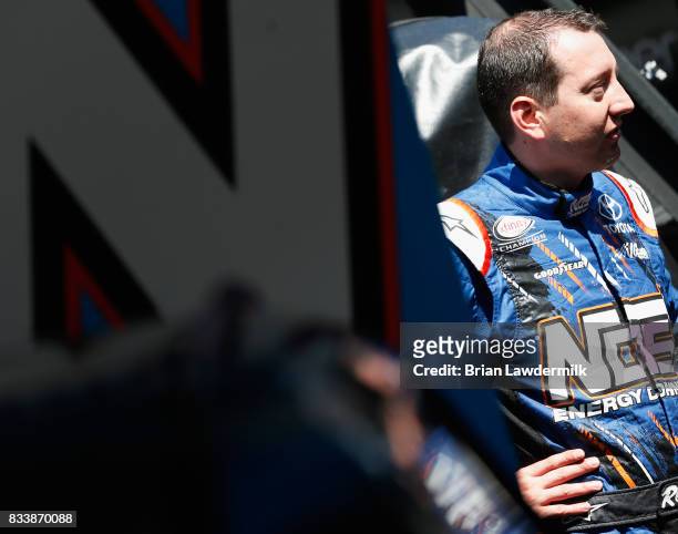 Kyle Busch, driver of the NOS Rowdy Toyota, stands by his car during practice for the NASCAR Xfinity Series Food City 300 at Bristol Motor Speedway...