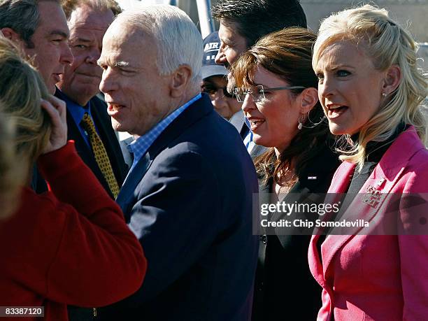 Republican presidential nominee Sen. John McCain , his wife Cindy McCain and McCain's running mate Alaska Governor Sarah Palin greet supporters...