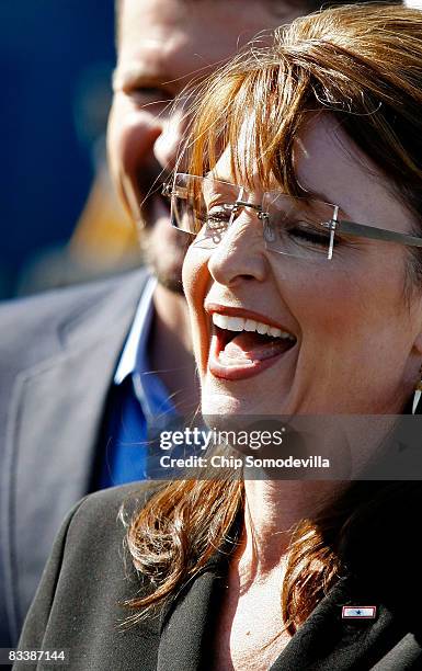 Republican vice presidential nominee Alaska Governor Sarah Palin talks with supporters on the tarmac at the Canton-Akron Airport October 22, 2008 in...