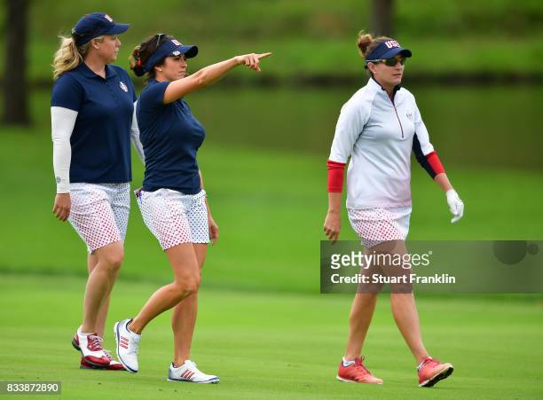 Brittany Lincicome, Gerina Piller and Brittany Lang of Team USA walk together during practice prior to The Solheim Cup at Des Moines Golf and Country...