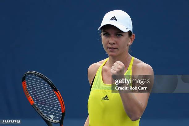 Simona Halep of Romania celebrates winning a point against Anastasija Sevastova of Latvia during Day 6 of the Western and Southern Open at the Linder...