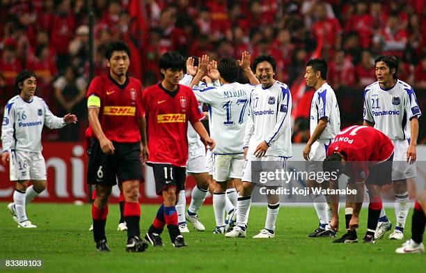 Gamba Osaka players celebrate the win over Urawa Red Diamonds after during the AFC Champions League semi-final second leg match between Urawa Red...