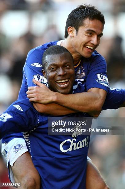 Everton's Ayegbeni Yakubu celebrates scoring the second goal with Tim Cahill