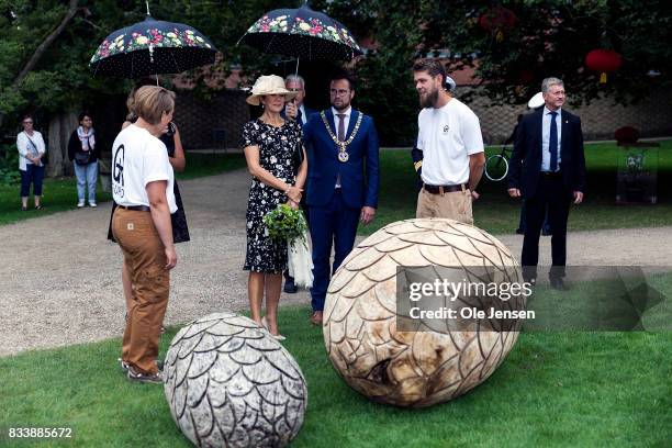 Crown Princess Mary is presented to garden art cut in wood by the company Guro during her visit to Odense Flower Festival which she is to open...