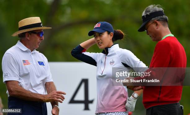 Michelle Wie of Team USA talks with her coach David Leadbetter during practice prior to The Solheim Cup at Des Moines Golf and Country Club on August...