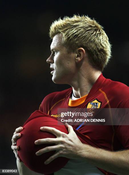 Roma's Norwegian player John Arne Riise prepares to take a thow-in against Chelsea during the Champions League Group A match at Stamford Bridge in...