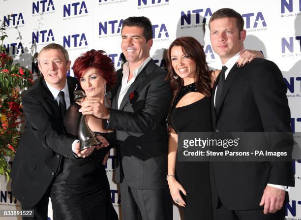 Louis Walsh, Sharon Osbourne, Simon Cowell, Dannii Minogue and Dermot O'Leary from X Factor with their award for Most Popular Talent Show, back stage...