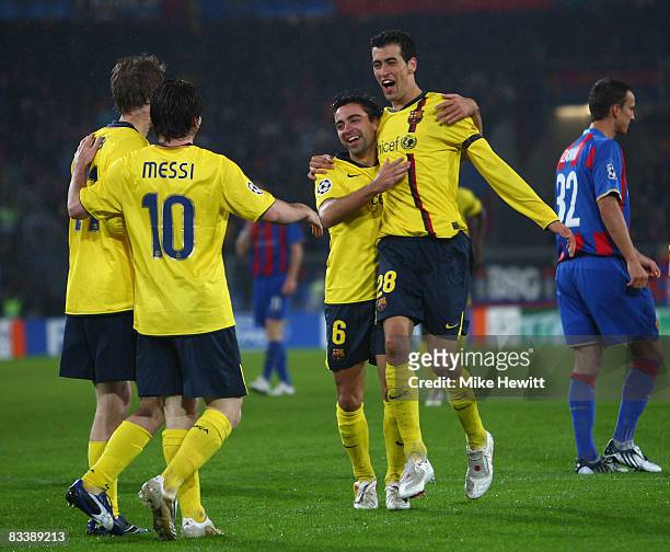 Alexsandr Hleb, Lional Messi and Sergi Busquets celebrate with goalscorer Xavi Hernandez during the UEFA Champions League Group C match between Basel...