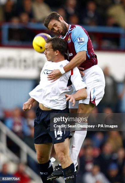 West Hamn United's Matthew Upson and Bolton Wanderers' Kevin Davies battle for the ball