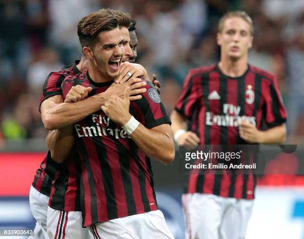 Andre Silva of AC Milan celebrates with his team-mate Fabio Borini after scoring his second goal during the UEFA Europa League Qualifying Play-Offs...