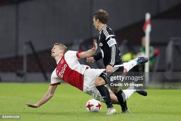 Matthijs de Ligt of Ajax, Mike Lindemann Jensen of Rosenborg BK during the UEFA Europa League fourth round qualifying first leg match between Ajax...