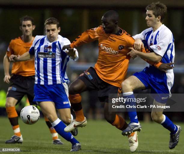 Dundee United's Morgaro Gomis tussles with Kilmarnock's Craig Bryson and Iain Flannigan during the Clydesdale Bank Scottish Premier League match at...