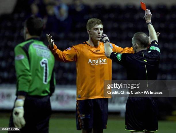 Dundee United's Jordan Robertson is sent off by referee David Somers after clashing with Kilmarnock goal keeper Alan Combe during the Clydesdale Bank...