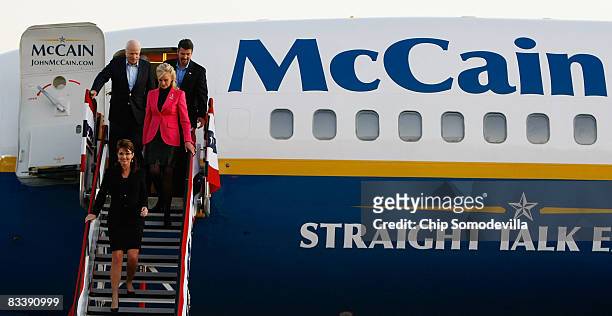 Republican presidential nominee John McCain, his wife Cindy McCain, his running mate Alaska Governor Sarah Palin and her husband Todd Palin walk off...