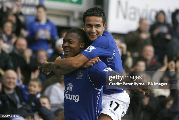 Everton's Ayegbeni Yakubu is congratulated by team mate Tim Cahill after scoring the first goal