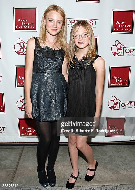 Actress Dakota Fanning and actress Elle Fanning arrive at The Optimist Youth Homes & Family Services' 2008 Mentor Awards Dinner and Fashion Show held...