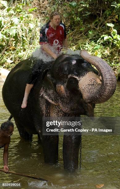 England's Matthew Hoggard baths with an elephant during a visit to Pinawella village near Kandy, Sri Lanka.