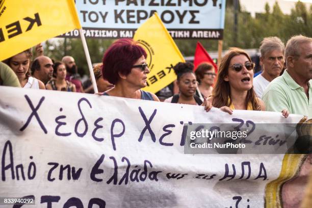 Demonstrators participate in a march and rally'From Athens to Charlottesvile' against white supremacy on August 17, 2017 in Athen, Greece. Protesters...