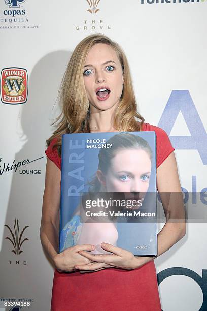 Actress Heather Graham arrives at the party to launch "Rare" by Nicole Maloney at the Grove on October 22, 2008 in Los Angeles, California.