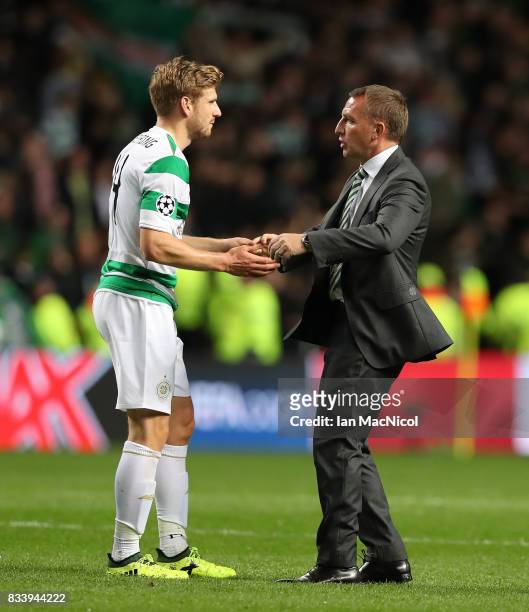 Celtic manager Brendan Rodgers and Stuart Armstrong of Celtic are seen during the UEFA Champions League Qualifying Play-Offs Round First Leg match...