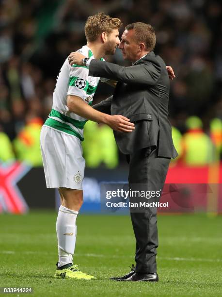 Celtic manager Brendan Rodgers and Stuart Armstrong of Celtic are seen during the UEFA Champions League Qualifying Play-Offs Round First Leg match...
