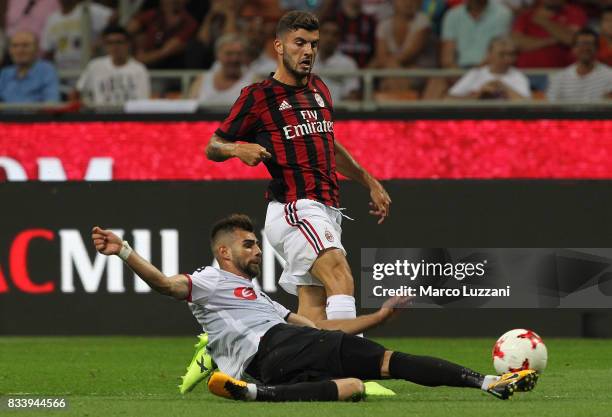 Patrick Cutrone of AC Milan is challenged by Egzon Bejtulai of KF Shkendija 79 during the UEFA Europa League Qualifying Play-Offs round first leg...