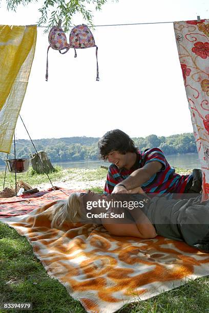 couple camping - draped blanket stock pictures, royalty-free photos & images